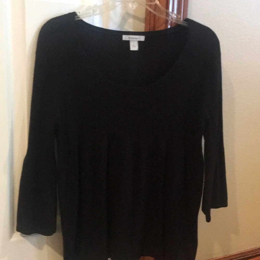 This is a sweater top that flares at the bottom